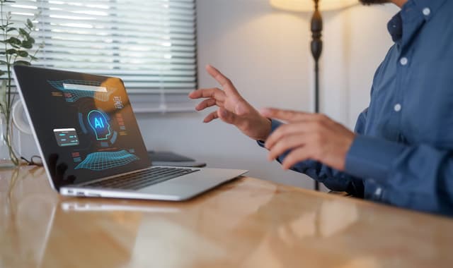 Business person working with an AI assistant on a laptop