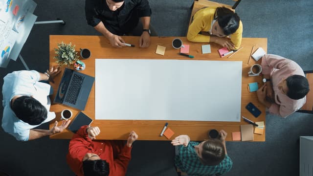 Team in a strategy planning session around a boardroom table